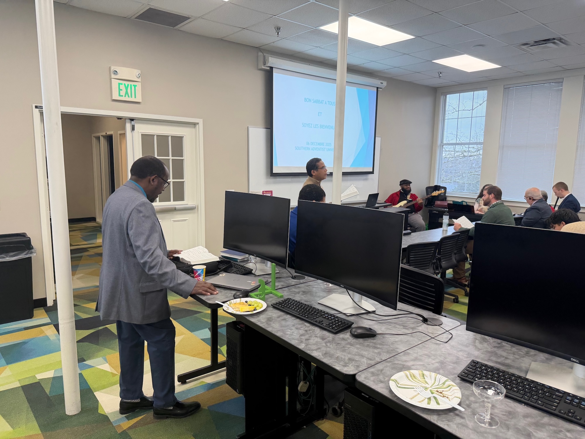 Three people sitting and talking