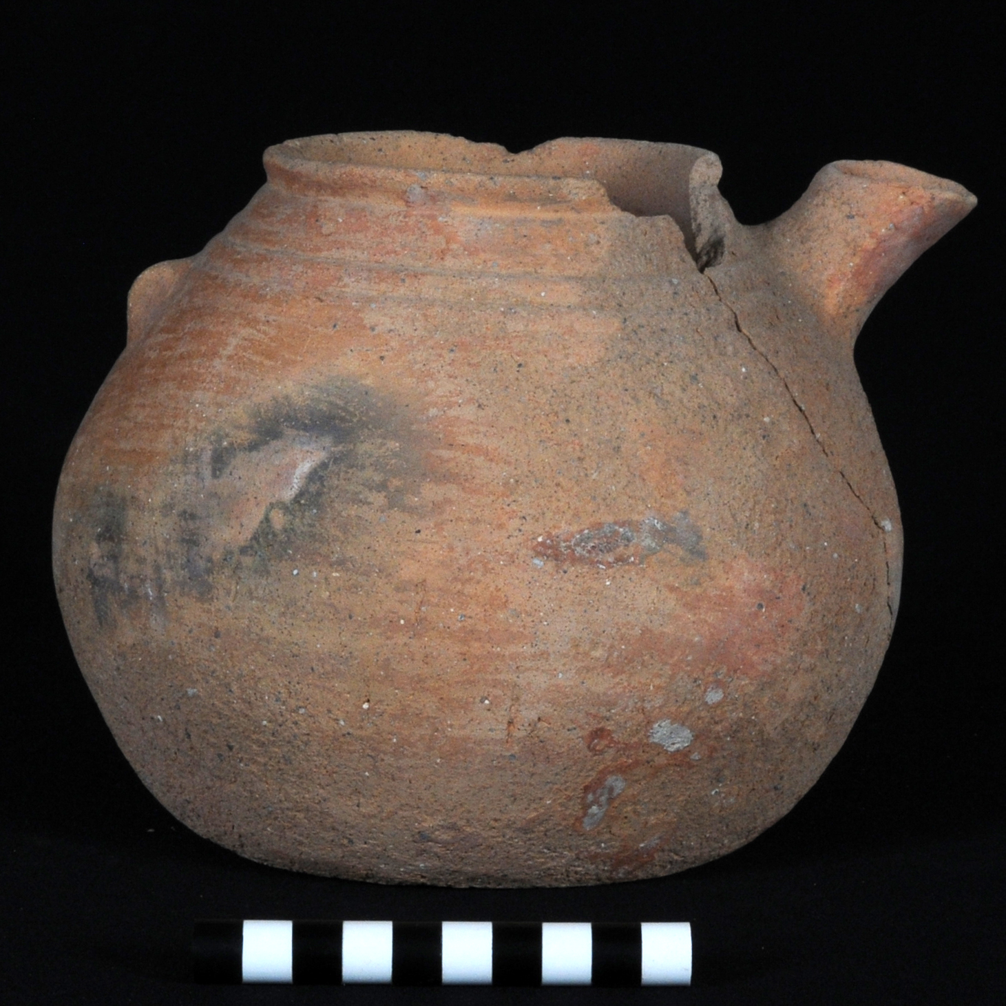 a brown teapot with a vestigial handle