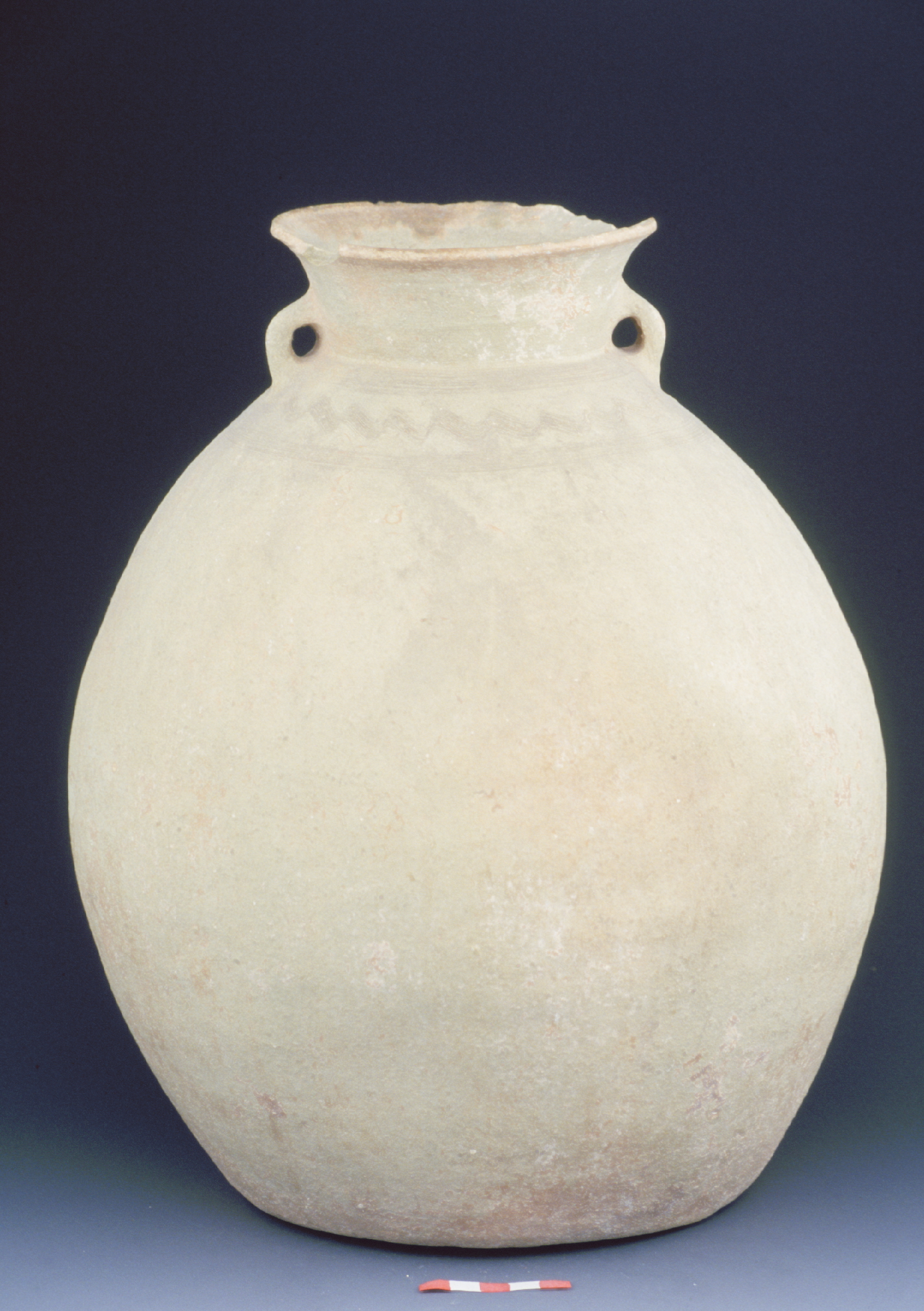 an off-white storage jar