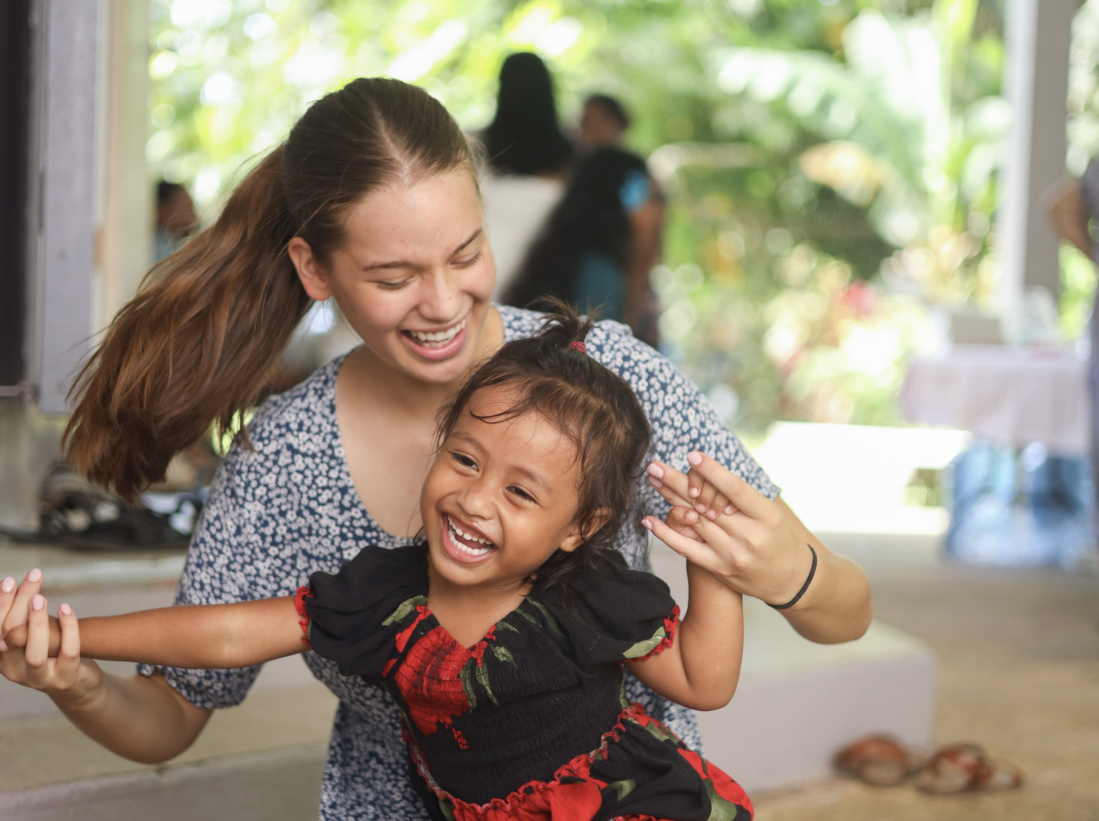 Valeishka Cruz with local student in Pohnpei Micronesia