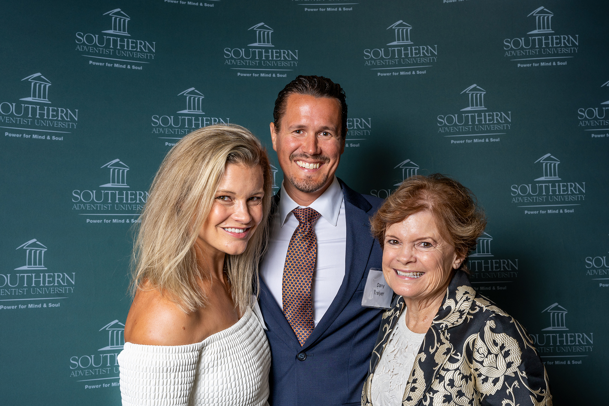 three people taking a photo