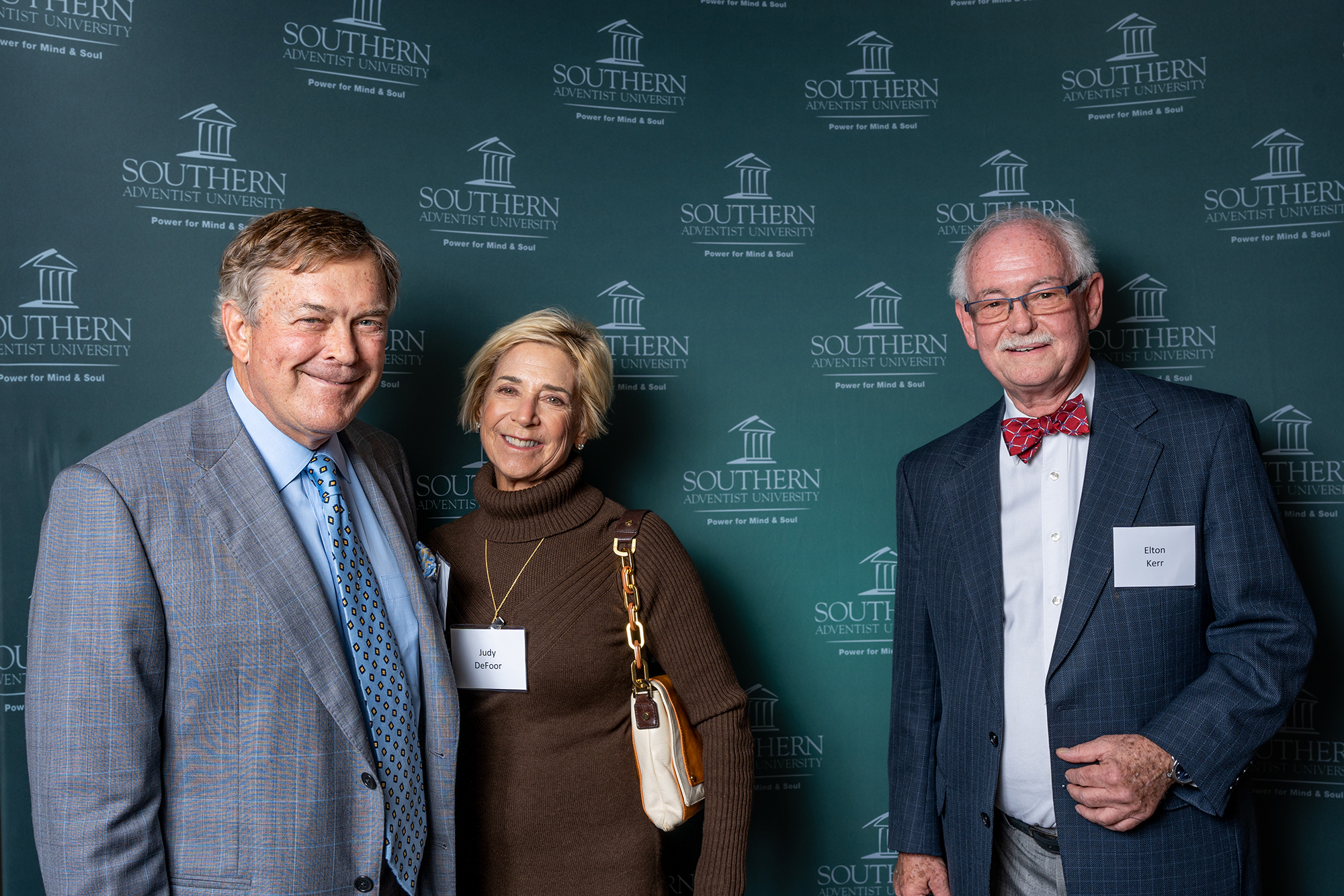 three people taking a photo