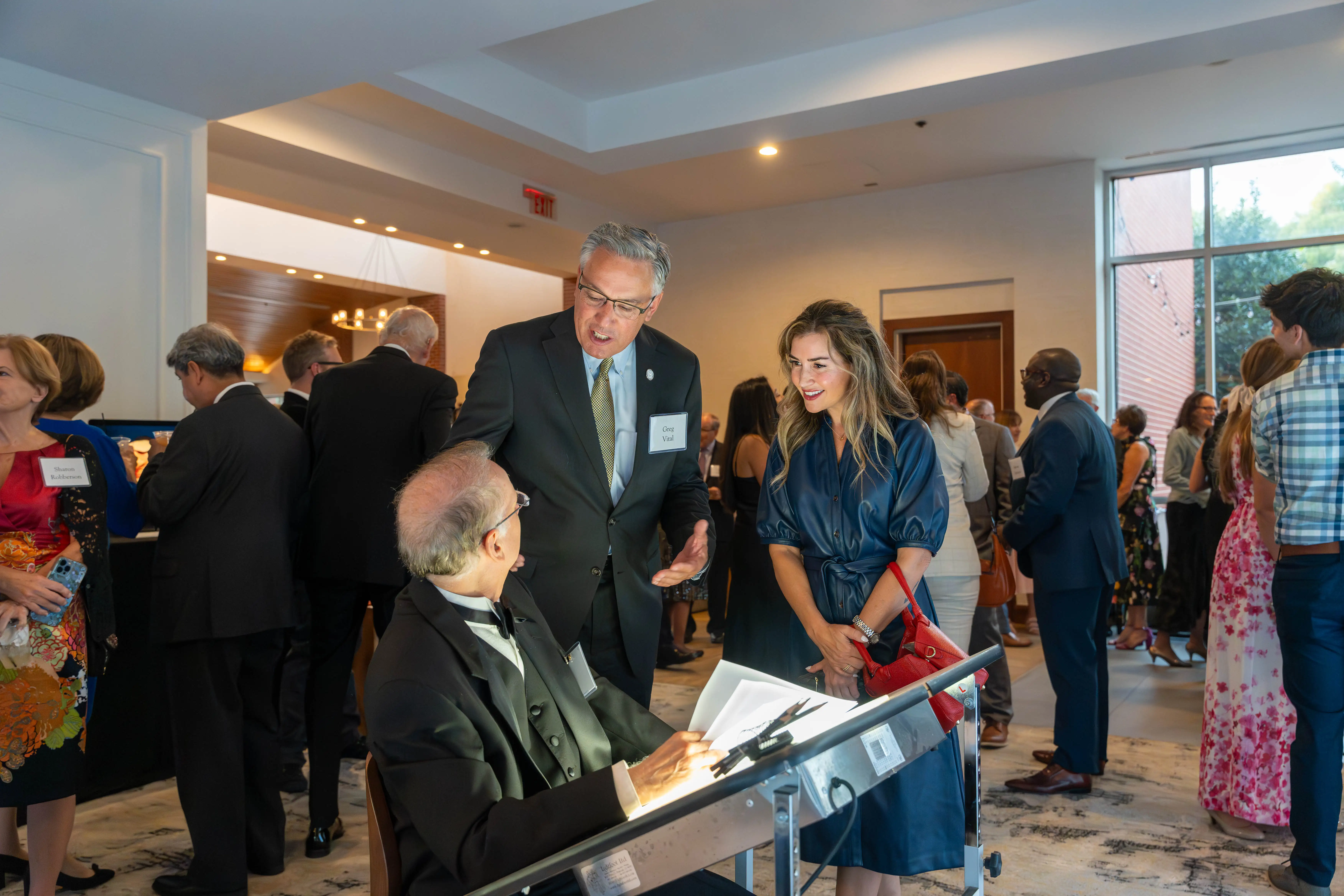 Hendel Butoy, Rep. Greg Vital, '14, and Ashely McCue