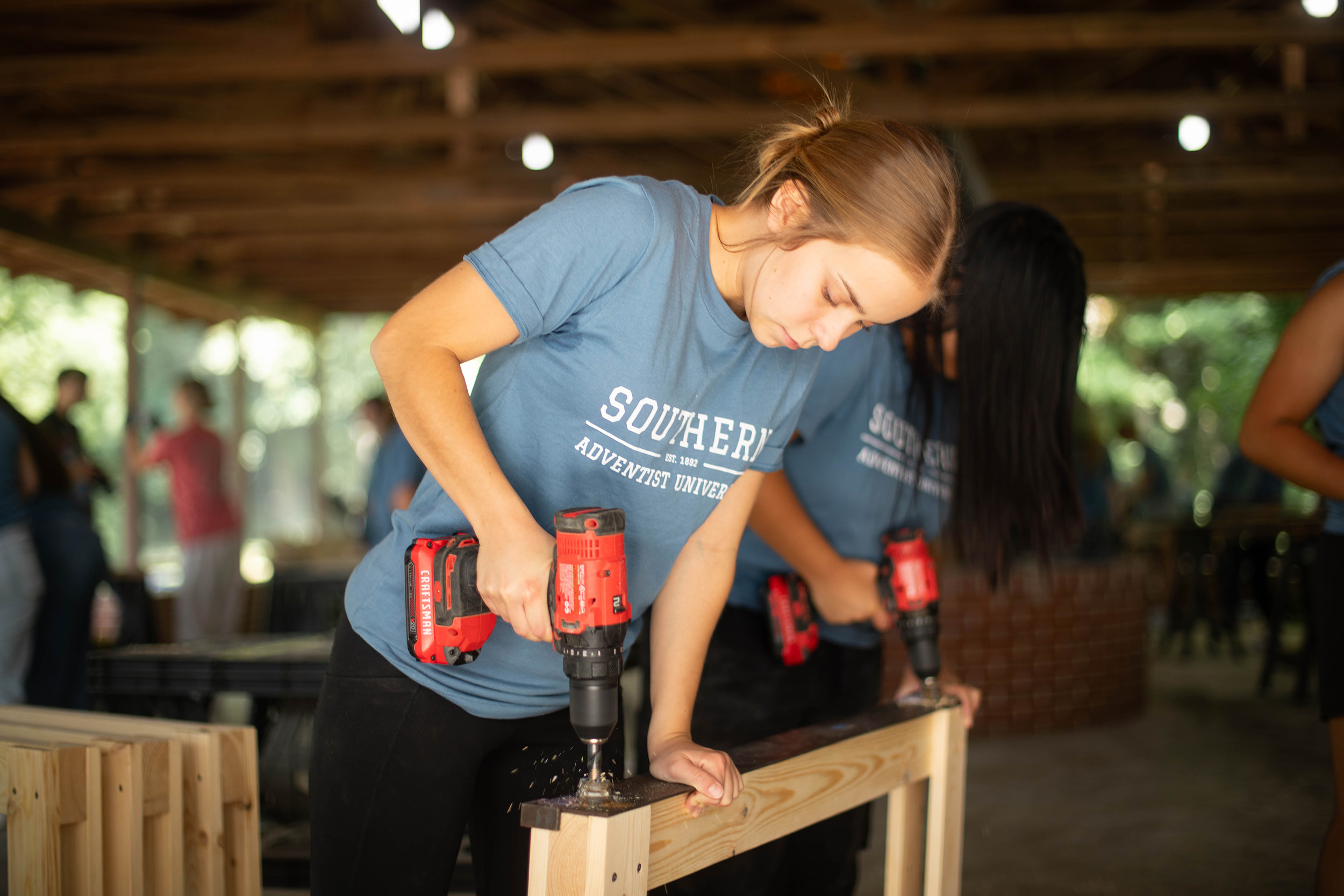 student helping with construction