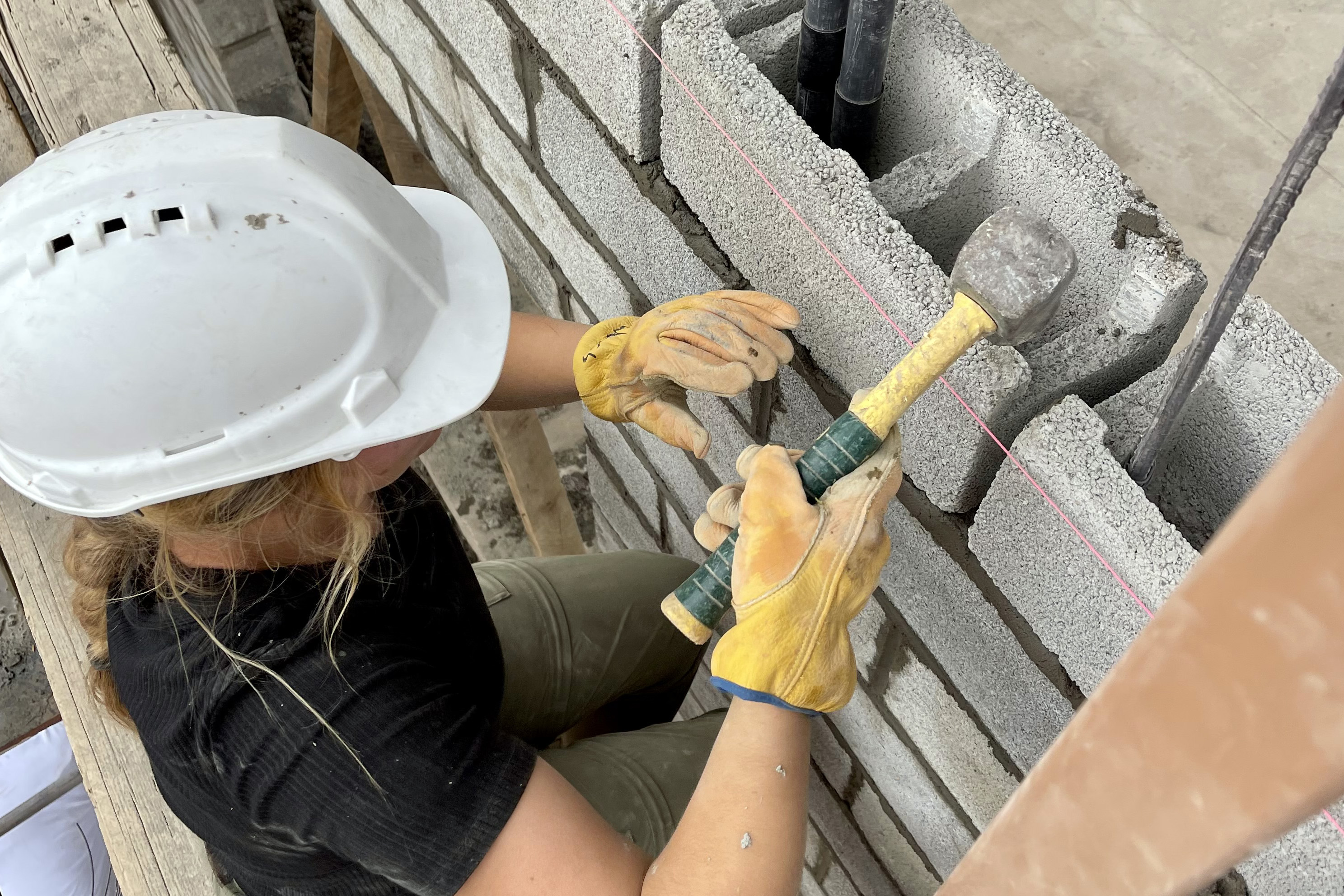 a student missionary building a construction project