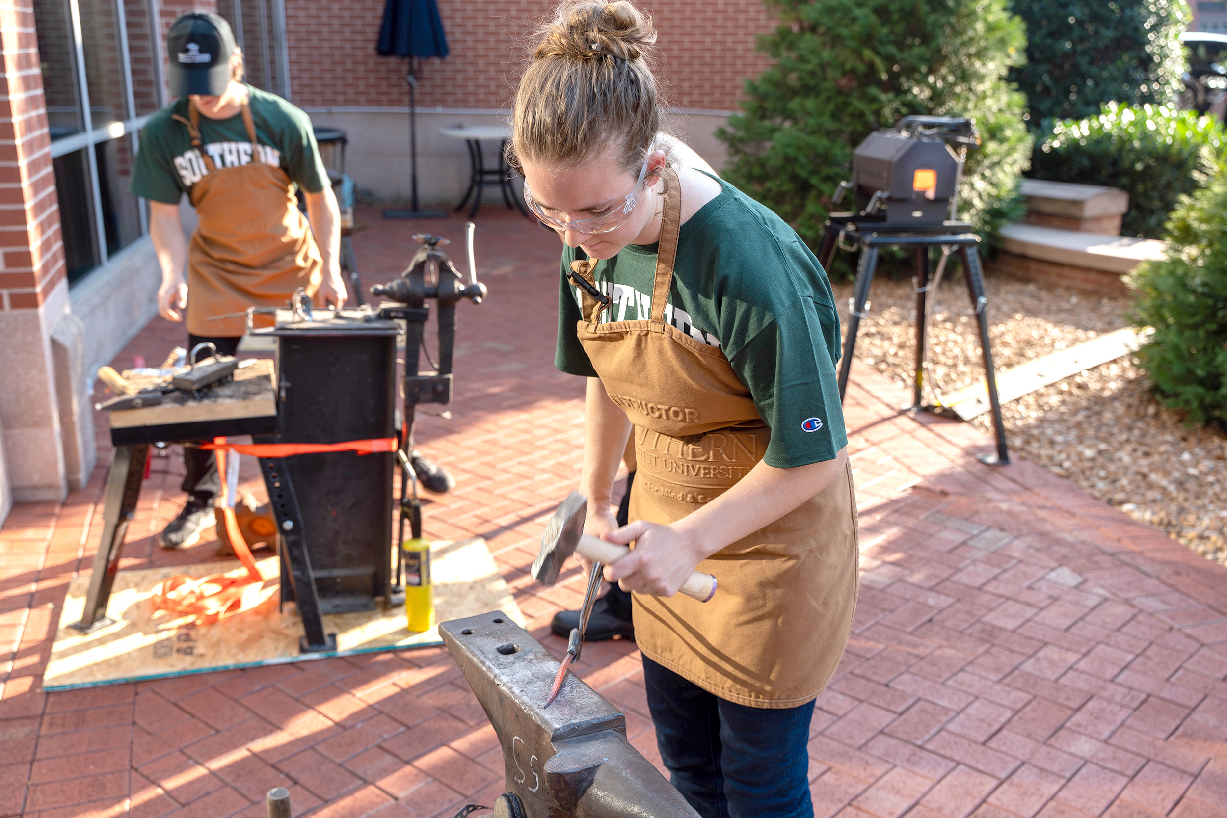 members of the blacksmithing club demonstrate their skills
