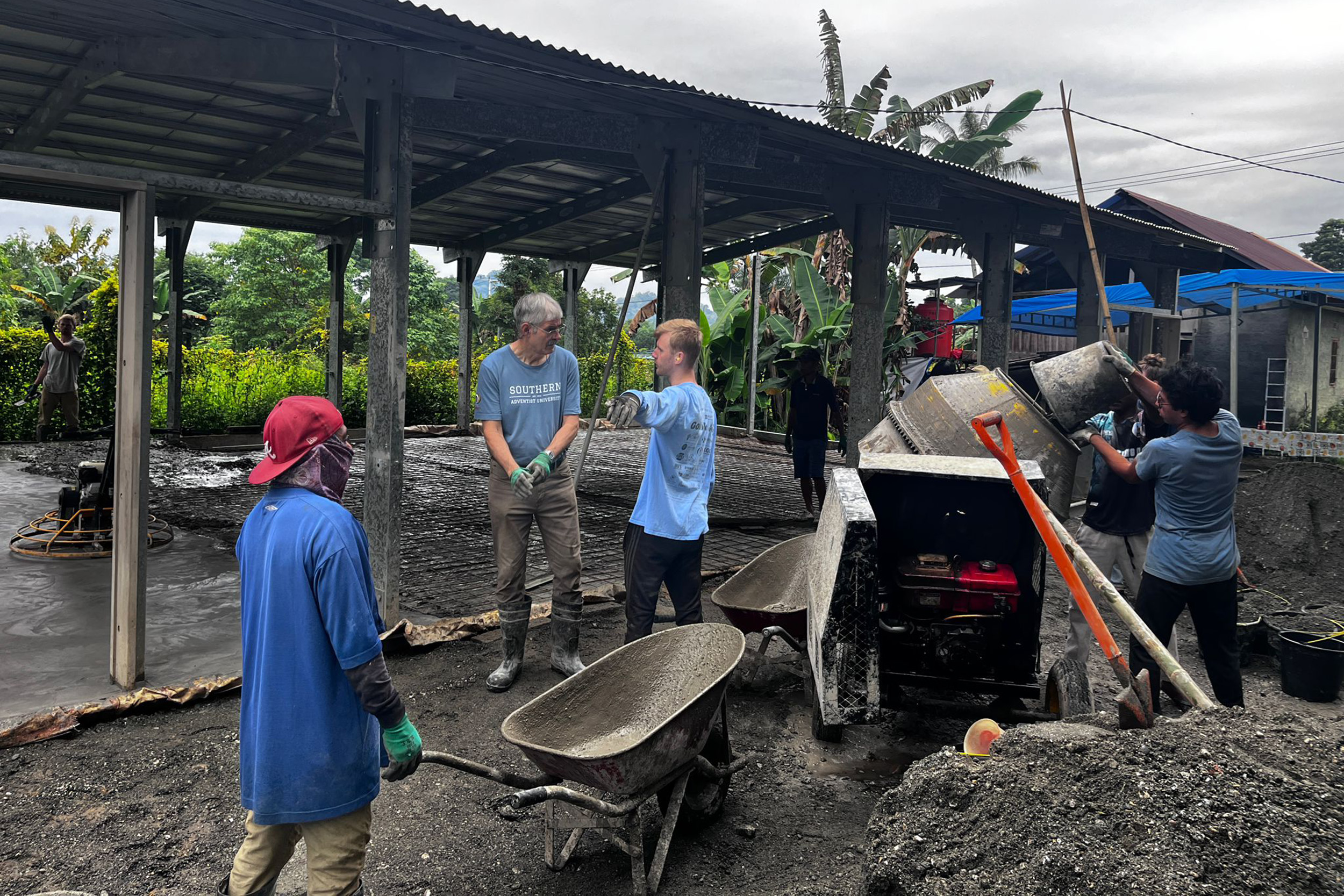 Missionaries work on a construction project